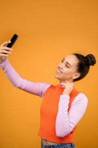 Smiling woman taking a selfie