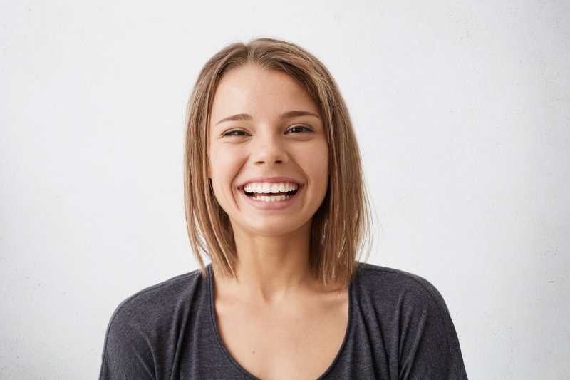 patient who underwent cosmetic dentistry smiling